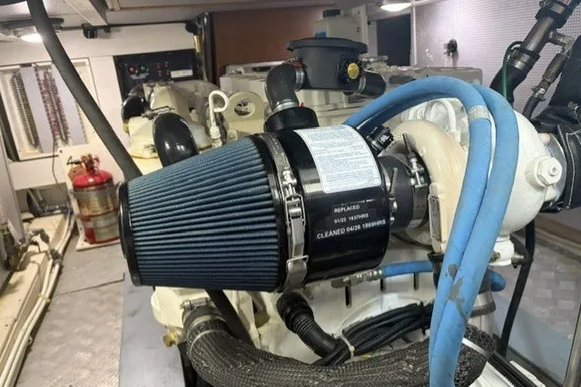 Slide: The Image of Engine room of a 2012 North Pacific Yachts 43, featuring a detailed air filter system. - 95