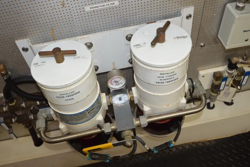 Slide: The Image of Engine fuel filter system on a 2012 North Pacific Yachts 43, featuring dual Racor filters. - 91
