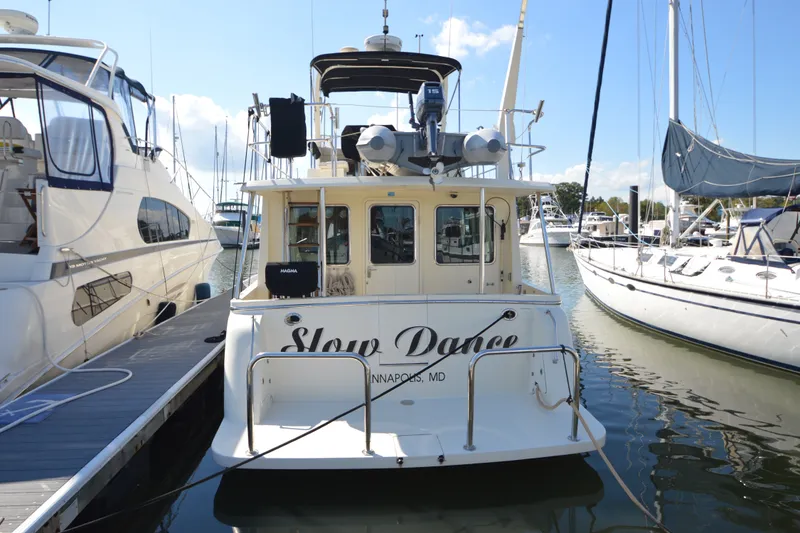 Slide: The Image of North Pacific Yachts 43, 2012 model, docked at marina with neighboring boats. - 29