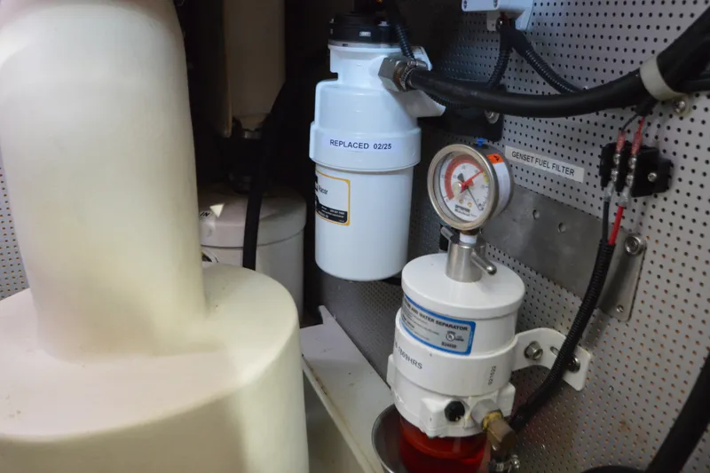 Slide: The Image of Engine room of 2012 North Pacific Yachts 43 with fuel filter system and gauge. - 107