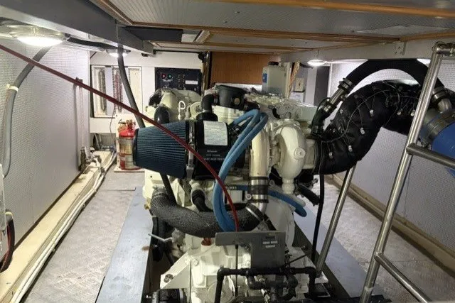 Slide: The Image of Engine room of a 2012 North Pacific Yachts 43, showcasing mechanical components and systems. - 92