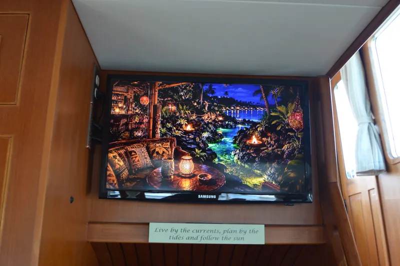 Slide: The Image of Flat-screen TV displaying tropical scene inside 2012 North Pacific Yachts 43. - 67