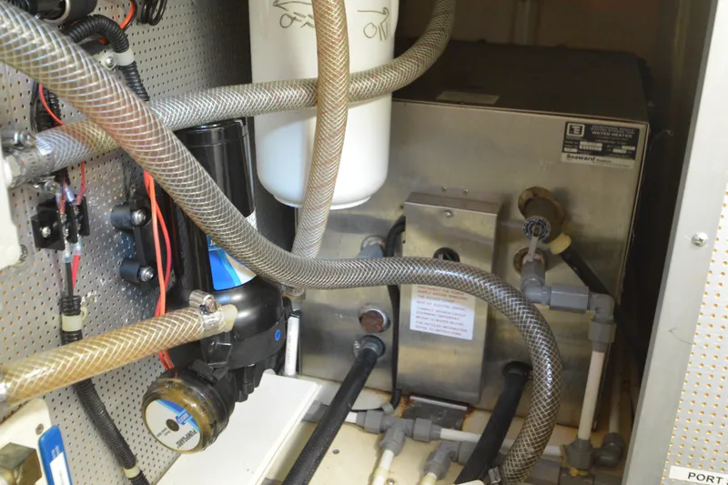Slide: The Image of Engine room of 2012 North Pacific Yachts 43, showcasing complex piping and machinery. - 94