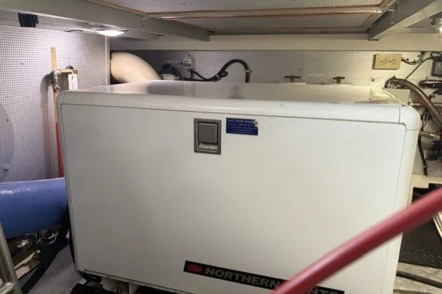 Slide: The Image of Engine room of 2012 North Pacific Yachts 43, featuring Northern Lights generator. - 99