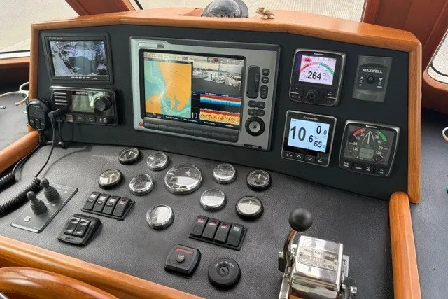 Slide: The Image of Helm of 2012 North Pacific Yachts 43, featuring navigation and control instruments. - 10