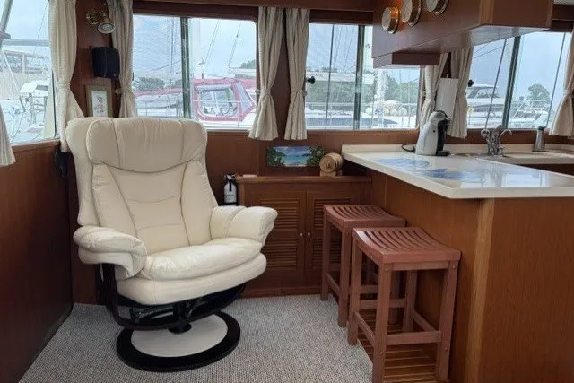Slide: The Image of Interior of 2012 North Pacific Yachts 43 with chair and bar stools. - 9