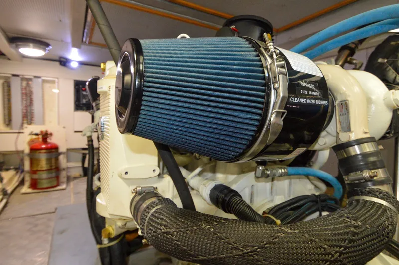Slide: The Image of Engine room of 2012 North Pacific Yachts 43, featuring a clean air filter system. - 88