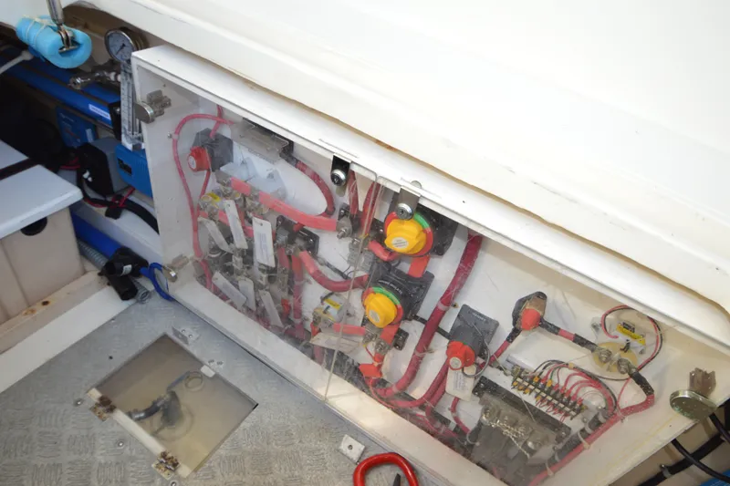 Slide: The Image of Electrical panel of a 2012 North Pacific Yachts 43, showcasing wiring and components. - 85