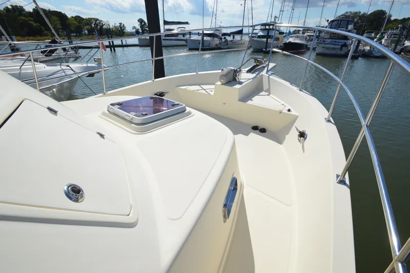 Slide: The Image of 2012 North Pacific Yachts 43 boat deck with railing, docked in marina. - 36