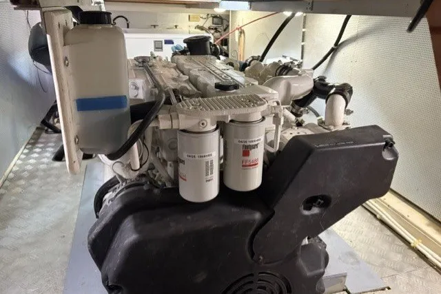 Slide: The Image of Engine room of a 2012 North Pacific Yachts 43, showcasing detailed mechanical components. - 104