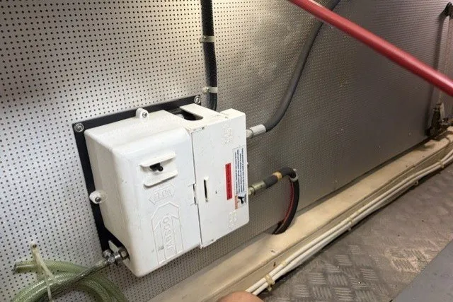 Slide: The Image of Electrical panel in a 2012 North Pacific Yachts 43 engine room, featuring wiring and safety components. - 102