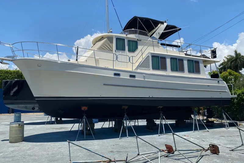 The Image of 2012 North Pacific Yachts 43 on dry dock under clear blue sky. - 0