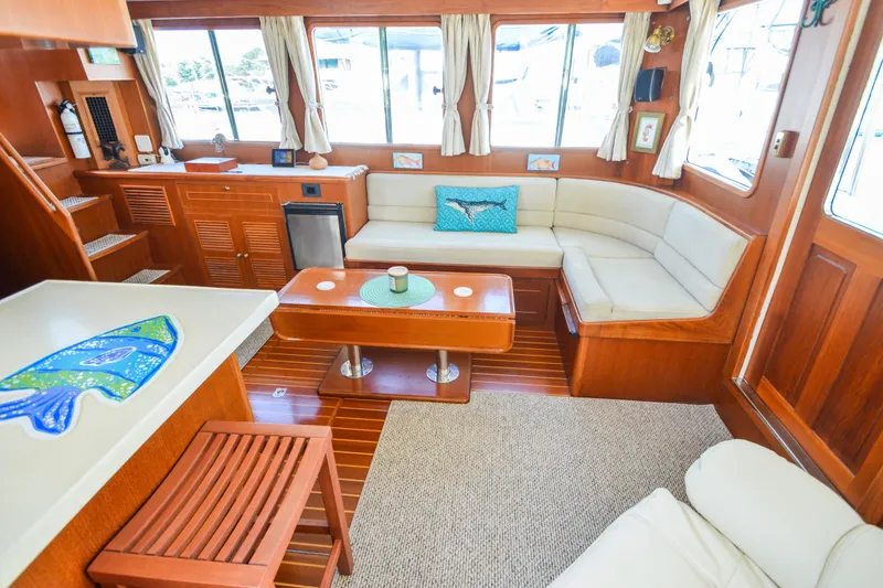Slide: The Image of Luxurious interior of 2012 North Pacific Yachts 43 with elegant wood finish and cozy seating. - 60
