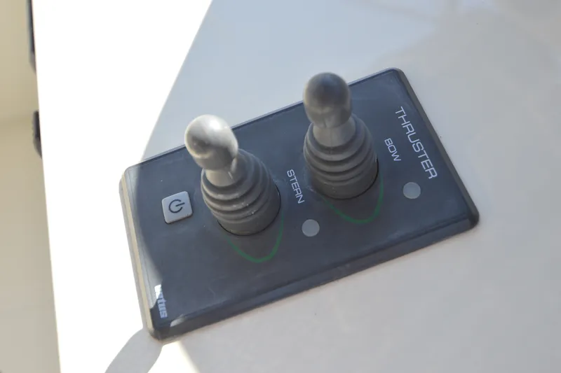 Slide: The Image of Control panel for bow and stern thrusters on a 2012 North Pacific Yachts 43. - 42