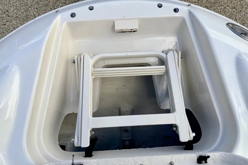 Slide: The Image of Bow storage compartment with ladder on 2000 Sea Ray 210 Sundeck boat. - 63