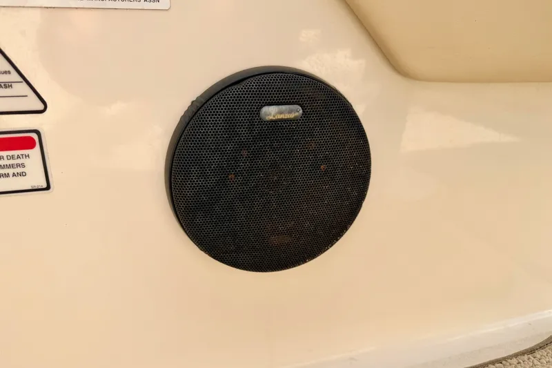 Slide: The Image of Speaker on a 2000 Sea Ray 210 Sundeck boat, with warning labels visible. - 42