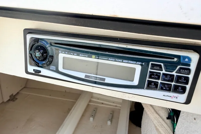 Slide: The Image of Marine stereo system on a 2000 Sea Ray 210 Sundeck boat dashboard. - 60