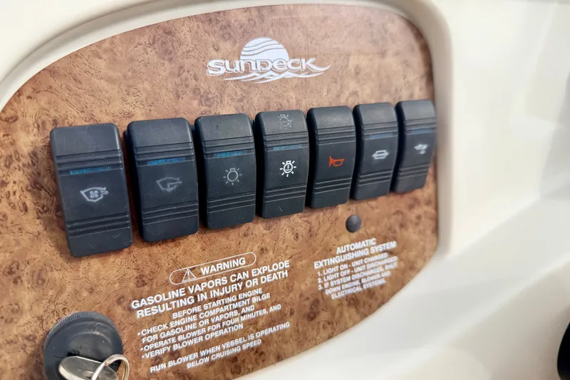 Slide: The Image of Control panel of a 2000 Sea Ray 210 Sundeck boat with warning labels. - 39