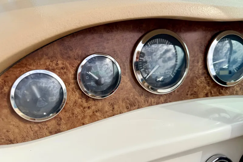 Slide: The Image of Dashboard gauges of a 2000 Sea Ray 210 Sundeck boat. - 36