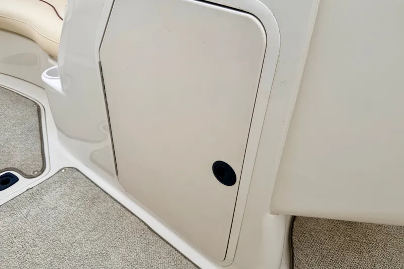 Slide: The Image of Storage compartment on a 2000 Sea Ray 210 Sundeck boat interior. - 58