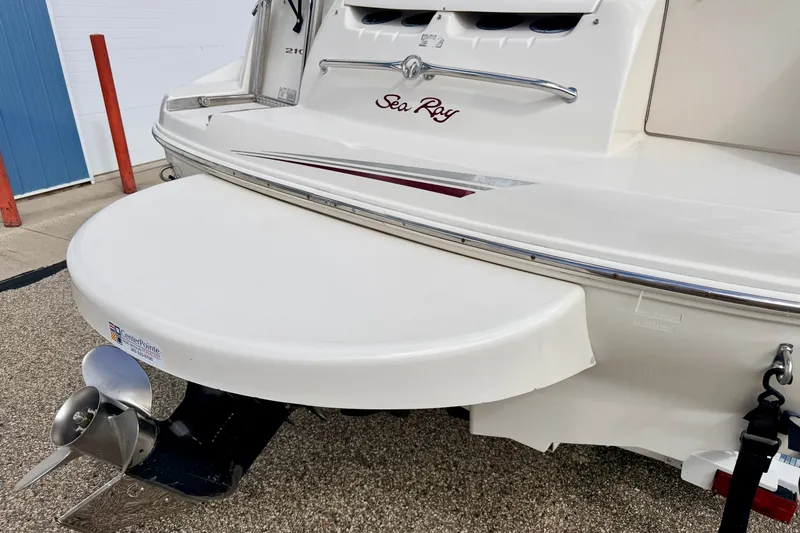 Slide: The Image of Rear view of a 2000 Sea Ray 210 Sundeck boat with propeller and swim platform. - 14