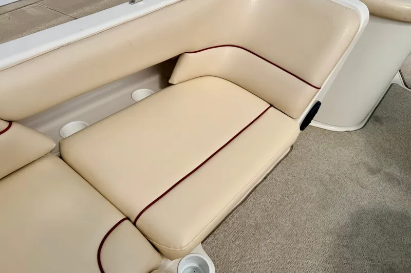 Slide: The Image of Beige seating on 2000 Sea Ray 210 Sundeck boat with red accents. - 30