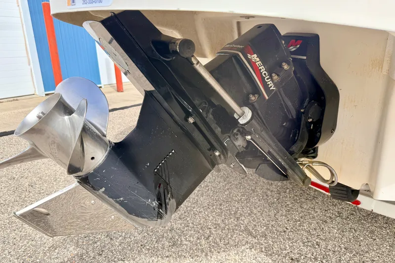 Slide: The Image of Outboard motor of a 2000 Sea Ray 210 Sundeck with Mercury branding. - 17