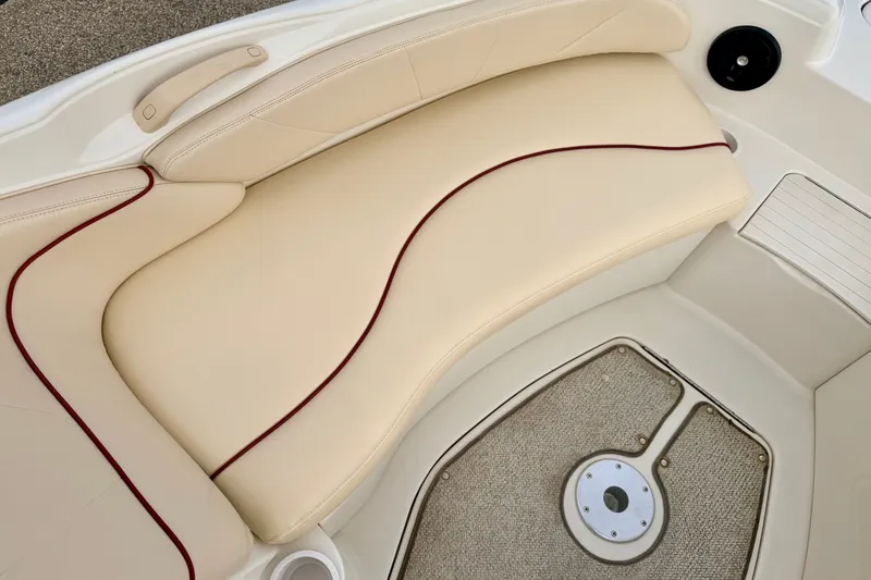 Slide: The Image of Beige seating area on a 2000 Sea Ray 210 Sundeck boat. - 49
