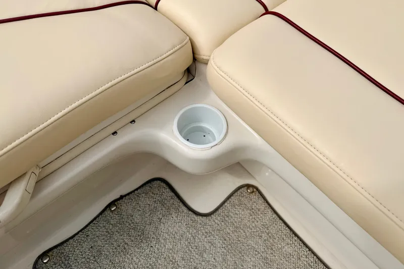 Slide: The Image of Beige seating with cup holder on 2000 Sea Ray 210 Sundeck boat. - 33