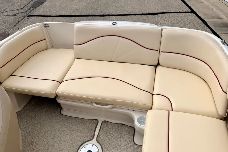 Slide: The Image of Beige seating area on a 2000 Sea Ray 210 Sundeck boat. - 21