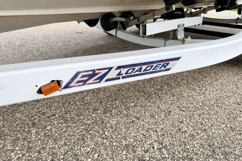 Slide: The Image of Trailer for 2000 Sea Ray 210 Sundeck with EZ Loader branding. - 73