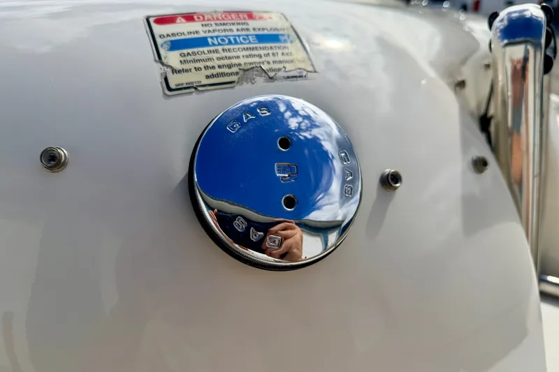 Slide: The Image of Gas cap on a 2000 Sea Ray 210 Sundeck boat with safety warning label. - 71