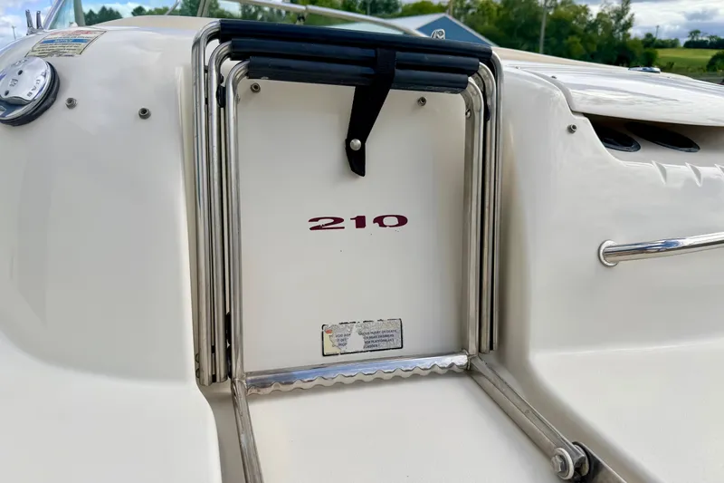 Slide: The Image of 2000 Sea Ray 210 Sundeck boat ladder and deck detail. - 16