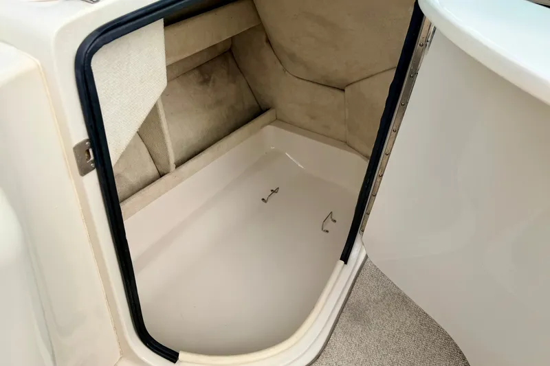 Slide: The Image of Interior storage compartment of a 2000 Sea Ray 210 Sundeck boat. - 46