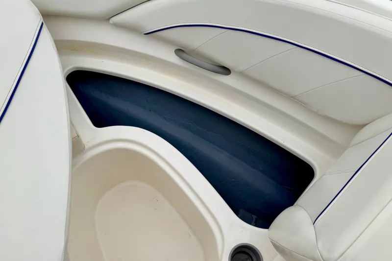 Slide: The Image of Interior seating of a 2007 Bayliner 195 Discovery boat with white upholstery. - 45