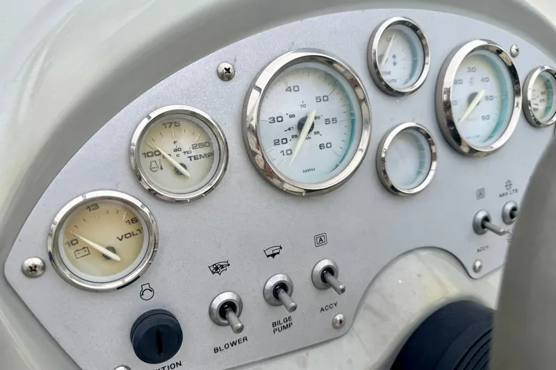 Slide: The Image of Dashboard of a 2007 Bayliner 195 Discovery boat with gauges and controls. - 32