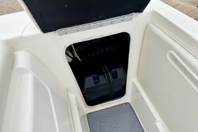 Slide: The Image of 2007 Bayliner 195 Discovery boat storage compartment with open hatch. - 26
