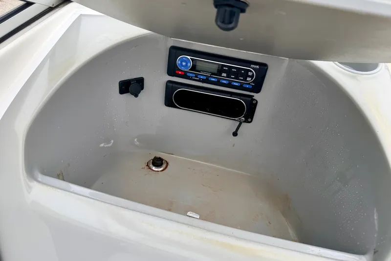 Slide: The Image of Storage compartment with stereo system in 2007 Bayliner 195 Discovery boat. - 38