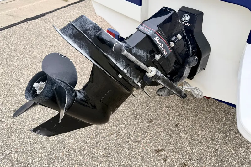 Slide: The Image of 2007 Bayliner 195 Discovery boat with MerCruiser outboard motor on pavement. - 17