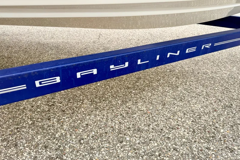 Slide: The Image of Blue Bayliner trailer for 2007 Bayliner 195 Discovery boat on pavement. - 58