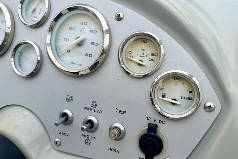 Slide: The Image of Dashboard of a 2007 Bayliner 195 Discovery boat with gauges and switches. - 33