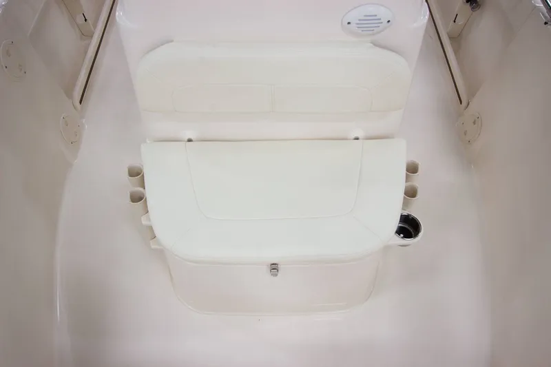 Slide: The Image of The image shows a white bench seat with cup holders on a boat. - 11