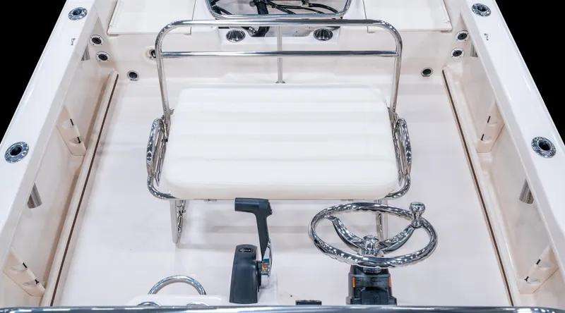 Slide: The Image of The image shows the cockpit of a 2027 Grady-White Fisherman 180 with a white seat and steering wheel. - 6