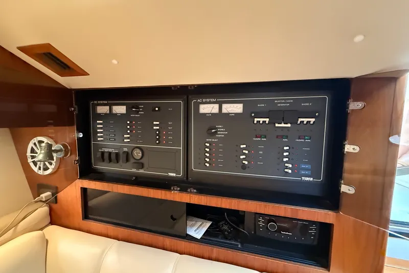 Slide: The Image of Electrical control panel inside a 2003 Tiara Yachts 3500 Open, featuring AC and DC systems. - 28