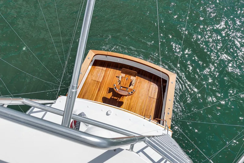 Slide: The Image of Overhead view of 1995 Merritt 65 Sport Fish yacht deck on sparkling water. - 24