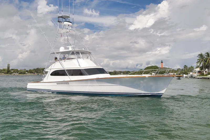 Slide: The Image of 1995 Merritt 65 Sport Fish yacht cruising on a scenic waterway. - 3