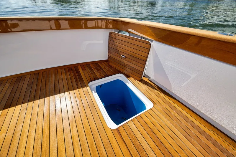 Slide: The Image of Teak deck of 1995 Merritt 65 Sport Fish boat with open hatch. - 22