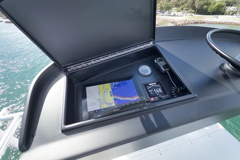 Slide: The Image of Control panel of a 1995 Merritt 65 Sport Fish boat with navigation equipment. - 13