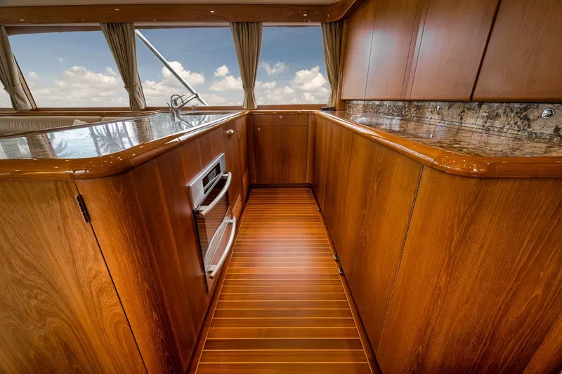 Slide: The Image of Luxurious wooden interior of a 1995 Merritt 65 Sport Fish yacht kitchen. - 42