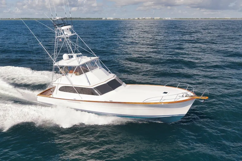 Slide: The Image of 1995 Merritt 65 Sport Fish yacht cruising on open ocean waters. - 55